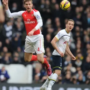 Per Mertesacker outjumps Harry Kane Print