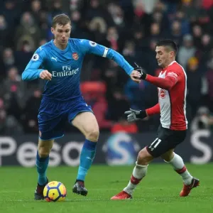 Per Mertesacker vs. Dusan Tadic: A Football Rivalry in the Southampton vs. Arsenal Premier League Clash (December 2017)