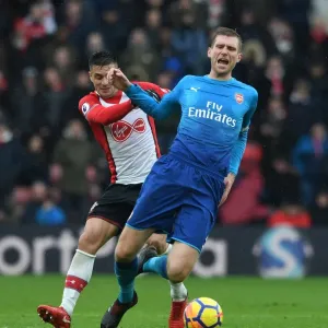 Per Mertesacker vs. Dusan Tadic: Intense Battle in Southampton v Arsenal Premier League Clash