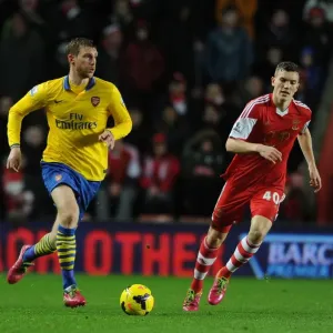 Per Mertesacker vs. Sam Gallagher: Intense Battle at Southampton's St Marys Stadium - Premier League 2013-14 Per Mertesacker vs. Sam Gallagher: Intense Battle at Southampton's St Marys Stadium - Premier League 2013-14