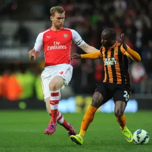 Per Mertesacker vs. Sone Aluko: Intense Tackle in Arsenal's Victory over Hull City, Premier League 2014/15