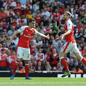 Mertesacker Welcomes Xhaka: A Moment of Camaraderie at Arsenal's Emirates Stadium