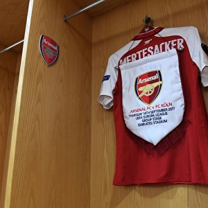 Per Mertesacker's Arsenal Shirt and Pennant in Arsenal Dressing Room (Arsenal v FC Köln, 2017-18)