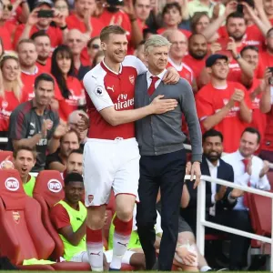 Mertesacker's Emotional Farewell Hug: Wenger's Last Match as Arsenal Manager (2018) Mertesacker's Emotional Farewell Hug: Wenger's Last Match as Arsenal Manager (2018)