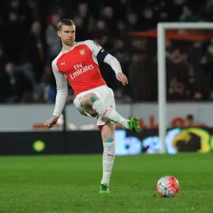 Per Mertesacker's Focus: Arsenal's Defender in FA Cup Fifth Round Replay against Hull City Per Mertesacker's Focus: Arsenal's Defender in FA Cup Fifth Round Replay against Hull City