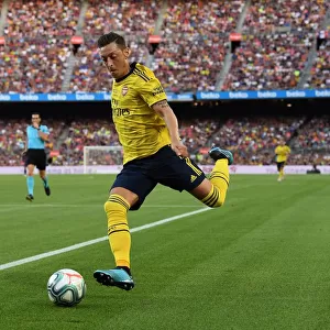 Mesut Ozil in Action: Arsenal vs. FC Barcelona, 2019 - The Thrilling Pre-Season Clash in Barcelona