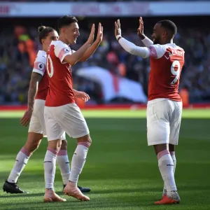 Mesut Ozil and Alexandre Lacazette Celebrate Goals: Arsenal's Winning Moment Against Watford (2018-19)