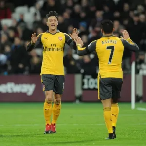Mesut Ozil and Alexis Sanchez Celebrate Goal for Arsenal against West Ham United, 2016-17 Season Mesut Ozil and Alexis Sanchez Celebrate Goal for Arsenal against West Ham United, 2016-17 Season