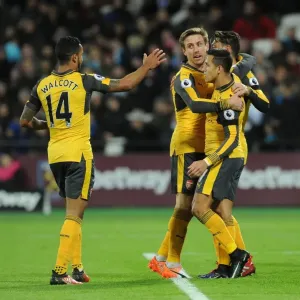 Mesut Ozil, Alexis Sanchez, Theo Walcott, and Nacho Monreal Celebrate Arsenal's First Goal Against West Ham United Mesut Ozil, Alexis Sanchez, Theo Walcott, and Nacho Monreal Celebrate Arsenal's First Goal Against West Ham United