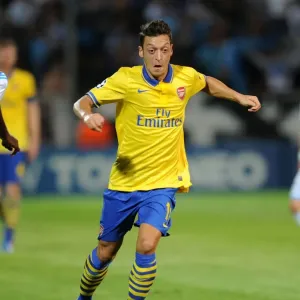 Mesut Ozil: Arsenal Star in Action against Olympique Marseille (2013-14 UEFA Champions League) Mesut Ozil: Arsenal Star in Action against Olympique Marseille (2013-14 UEFA Champions League)