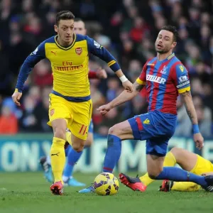 Mesut Ozil Breaks Past Crystal Palace's Damien Delaney during Arsenal's Premier League Victory