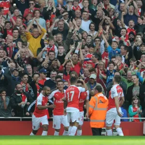 Mesut Ozil celebrates Arsenals 2nd goal with his team mates Mesut Ozil celebrates Arsenals 2nd goal with his team mates