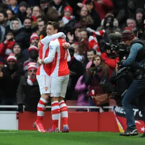 Mesut Ozil celebrates scoring Arsenals 2nd goal with Santi Cazorla. Arsenal 5: 0 Aston Villa