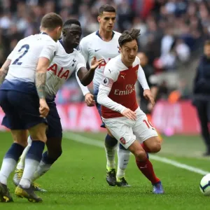 Mesut Ozil Clashes with Triple Threat: Tripper, Sanchez, and Lamela in Intense Tottenham-Arsenal Rivalry
