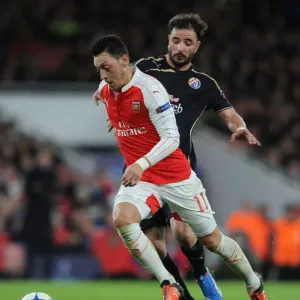 Mesut Ozil Escapes Past Goncalo Santos: Arsenal's Thrilling Chase in the UEFA Champions League vs. Dinamo Zagreb, 2015 Mesut Ozil Escapes Past Goncalo Santos: Arsenal's Thrilling Chase in the UEFA Champions League vs. Dinamo Zagreb, 2015