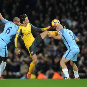 Mesut Ozil Faces Off Against Pablo Zabaleta and Fernando Reges in Manchester City vs Arsenal Clash Mesut Ozil Faces Off Against Pablo Zabaleta and Fernando Reges in Manchester City vs Arsenal Clash