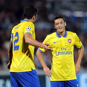 Mesut Ozil and Olivier Giroud: Arsenal's Dynamic Duo in Action against Olympique de Marseille, UEFA Champions League, 2013