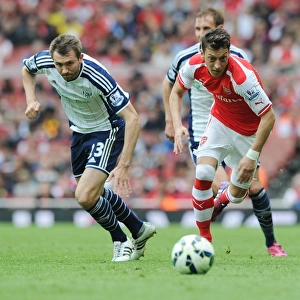 Mesut Ozil Outmaneuvers Gareth McAuley: Arsenal's Thrilling Victory over West Bromwich Albion, Premier League 2014/15