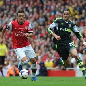 Mesut Ozil Outmaneuvers Geoff Cameron in Arsenal's Victory over Stoke City Mesut Ozil Outmaneuvers Geoff Cameron in Arsenal's Victory over Stoke City