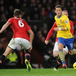 Mesut Ozil Outruns Wayne Rooney and Jonny Evans: Manchester United vs Arsenal, Premier League 2013-14 Mesut Ozil Outruns Wayne Rooney and Jonny Evans: Manchester United vs Arsenal, Premier League 2013-14