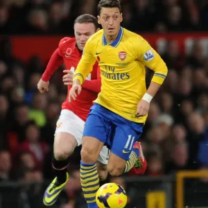 Mesut Ozil Outruns Wayne Rooney: Manchester United vs. Arsenal, Premier League 2013-14 Mesut Ozil Outruns Wayne Rooney: Manchester United vs. Arsenal, Premier League 2013-14