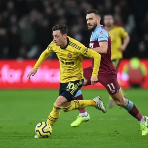 Mesut Ozil Under Pressure: West Ham vs. Arsenal, Premier League 2019-20: A Battle at London Stadium
