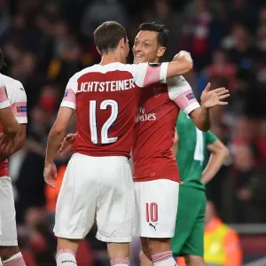 Mesut Ozil and Stephan Lichtsteiner Celebrate Arsenal's Goals Against Vorskla Poltava in Europa League