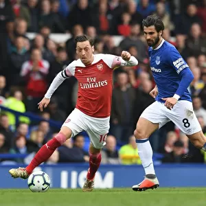 Mesut Ozil vs. Andre Gomes: Intense Battle at Goodison Park during Arsenal's Premier League Clash with Everton