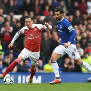 Mesut Ozil vs. Andre Gomes: Intense Battle at Goodison Park during Arsenal's Premier League Clash with Everton Mesut Ozil vs. Andre Gomes: Intense Battle at Goodison Park during Arsenal's Premier League Clash with Everton