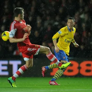 Mesut Ozil vs Calum Chambers: A Football Showdown at Southampton's St Marys Stadium (Arsenal vs Southampton 2013-14) Mesut Ozil vs Calum Chambers: A Football Showdown at Southampton's St Marys Stadium (Arsenal vs Southampton 2013-14)