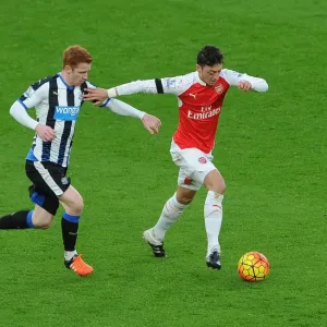 Mesut Ozil vs Jack Colback: A Fierce On-Pitch Battle at Arsenal's Emirates Stadium (Arsenal v Newcastle United, 2015-16)