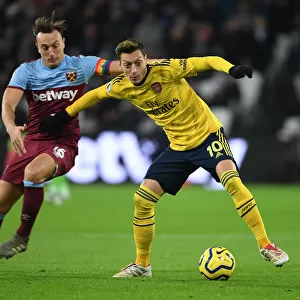 Mesut Ozil vs Mark Noble: Intense Battle at London Stadium - West Ham United vs Arsenal FC, Premier League 2019-20