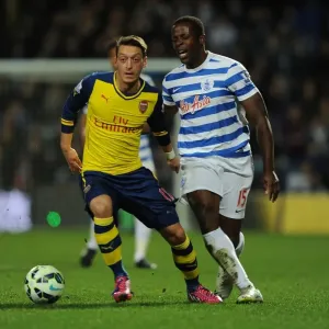 Mesut Ozil vs Nedum Onuoha: Intense Clash Between Queens Park Rangers and Arsenal in the Premier League