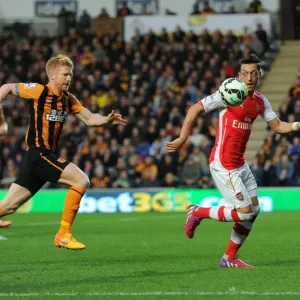 Mesut Ozil vs. Paul McShane: A Battle of Skills in the Intense Hull City vs. Arsenal Clash, Premier League 2014/15