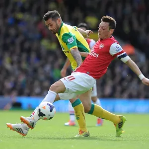 Mesut Ozil vs. Robert Snodgrass: Intense Battle at Carrow Road - Norwich City vs. Arsenal (2013-14)