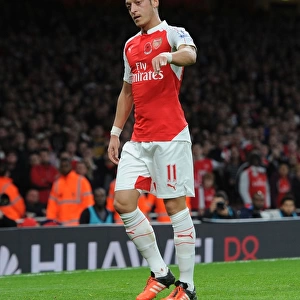 Mesut Ozil's Passionate Moment: Throwing Arsenal Badge in Intense Arsenal vs. Tottenham Rivalry (2015-16)