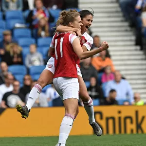 Miedema and van de Donk Celebrate Goal for Arsenal against Brighton Women