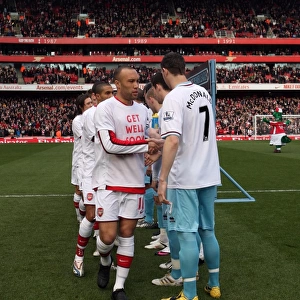 Mikael Silvestre (Arsenal) shakes hands with Kevin McDonald (Burnley). Arsenal 3