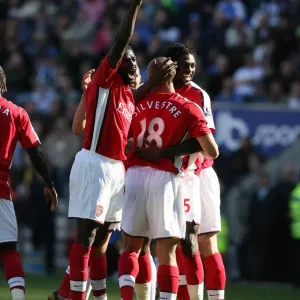 Mikael Silvestre, Kolo Toure, and Emmanuel Adebayor: Arsenal's Unstoppable Duo Celebrates Double Strike Against Wigan Athletic (4-1) Mikael Silvestre, Kolo Toure, and Emmanuel Adebayor: Arsenal's Unstoppable Duo Celebrates Double Strike Against Wigan Athletic (4-1)