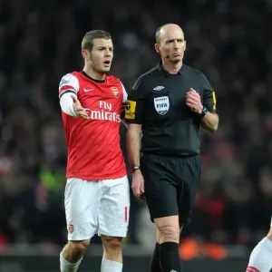 Mike Dean and Jack Wilshere: A Moment of Discussion during Arsenal vs Manchester City (2012-13) Mike Dean and Jack Wilshere: A Moment of Discussion during Arsenal vs Manchester City (2012-13)
