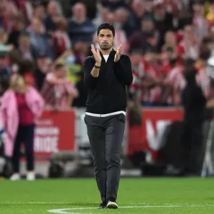 Mikel Arteta Celebrates with Arsenal Fans: Victory at Brentford in 2021-22 Premier League Mikel Arteta Celebrates with Arsenal Fans: Victory at Brentford in 2021-22 Premier League