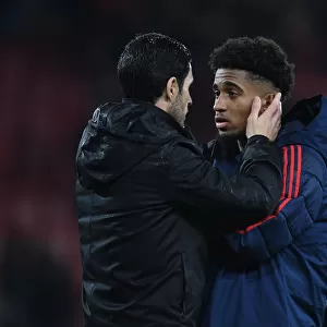 Mikel Arteta Comforts Reiss Nelson: A Moment of Consolation after AFC Bournemouth vs Arsenal (Premier League 2019-20)