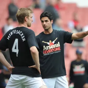 Mikel Arteta and Per Mertesacker (Arsenal) warm up in thier Arsenal for Everyone T Shirt