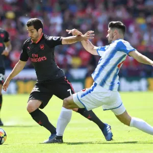Mkhitaryan vs Schindler: Intense Battle in Huddersfield Town vs Arsenal Premier League Clash Mkhitaryan vs Schindler: Intense Battle in Huddersfield Town vs Arsenal Premier League Clash