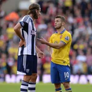 A Moment of Sportsmanship: Wilshere and Olsson's Calm Exchange Amidst West Bromwich Albion vs. Arsenal Rivalry (2013-14)
