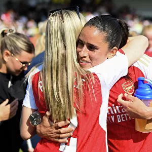 A Moment of Triumph: Leah Williamson and Rafaelle Souza's Embrace - Arsenal Women Celebrate FA WSL Title (2022-23)