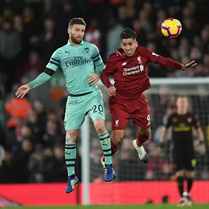 Mustafi vs. Firmino: Heading Clash in the Premier League Battle between Liverpool and Arsenal