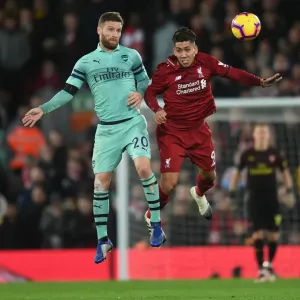 Mustafi vs. Firmino: Heading Clash in the Premier League Battle between Liverpool and Arsenal