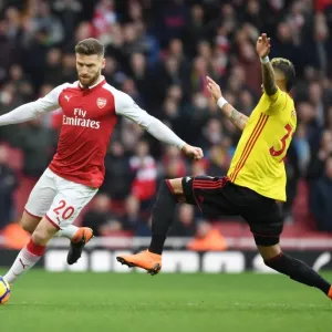 Mustafi vs. Pereyra: Intense Clash Between Arsenal and Watford Players