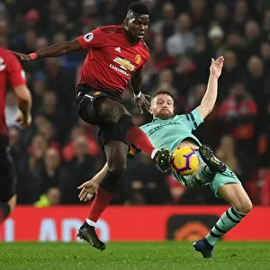 Mustafi vs Pogba: A Footballing Battle in the Premier League Clash between Manchester United and Arsenal FC